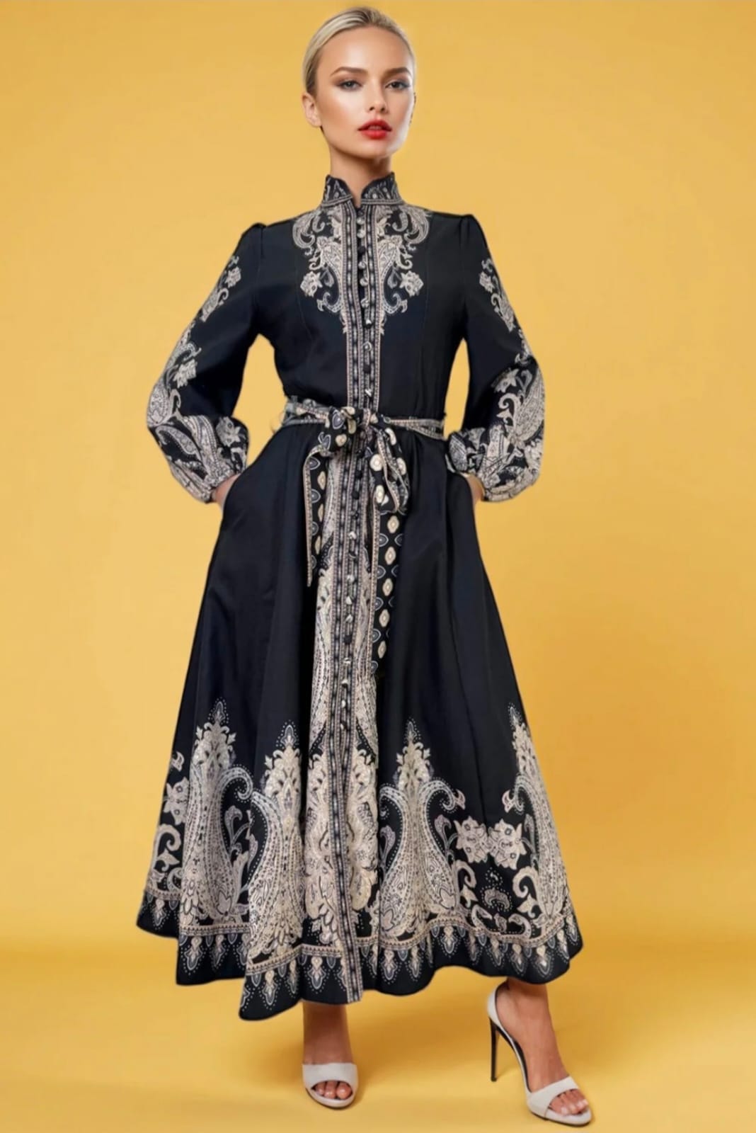 Woman wearing ornate embroidered black dress
