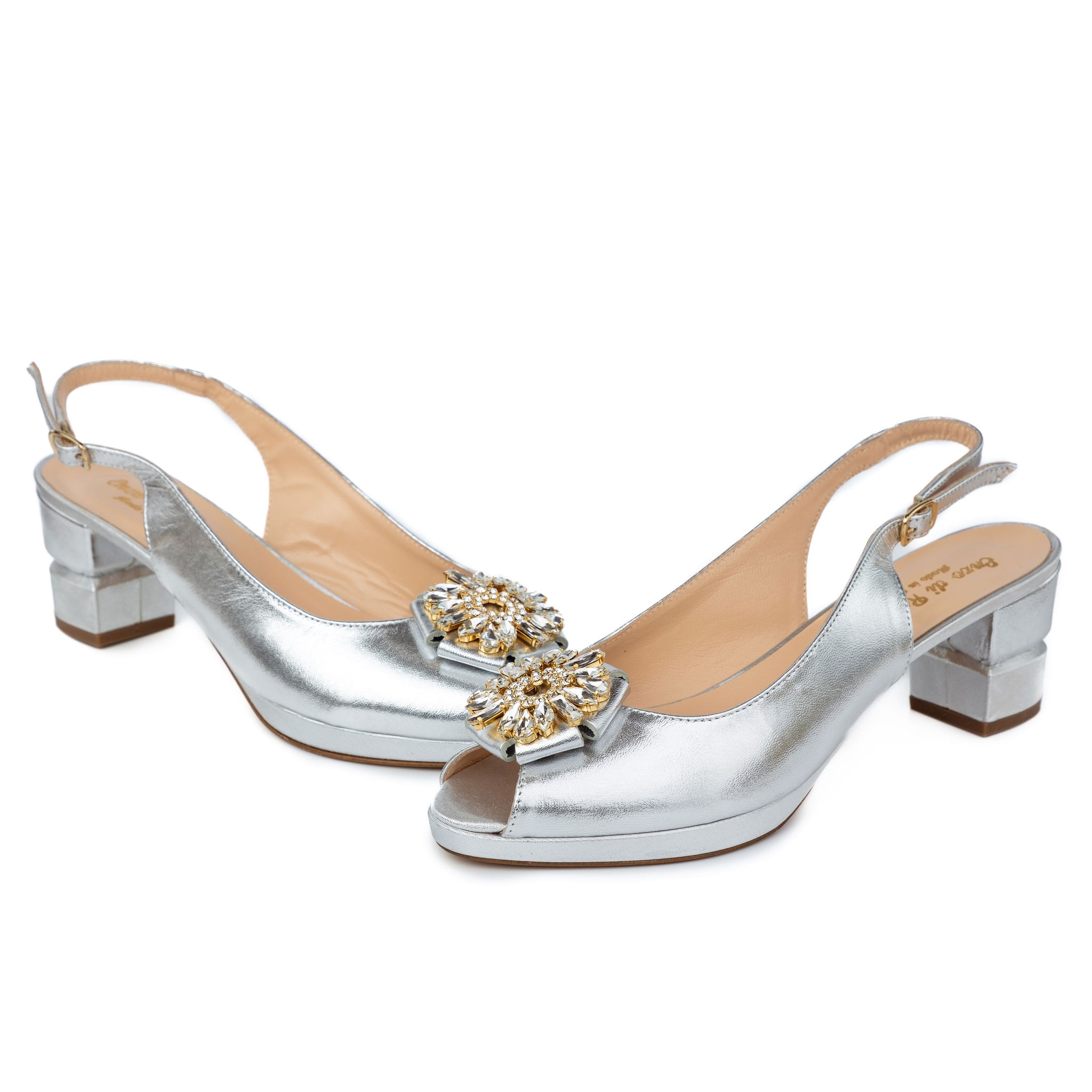Silver metallic slingback heels with jeweled brooch